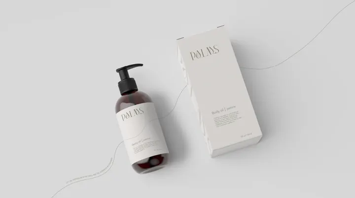 Botella de aceite corporal con su caja, empaque minimalista